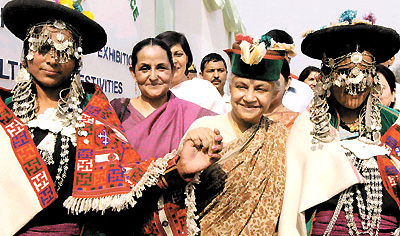 Delhi Chief Minister Sheila Dikshit, Mrs Swatantra Kaur, Chairperson of ITBP Himveer's Wives Welfare Association, with some of the traditional dancers of Ladakh during the inauguration of Indo-Tibetan Border Police welfare exhibition in the Capital on Monday