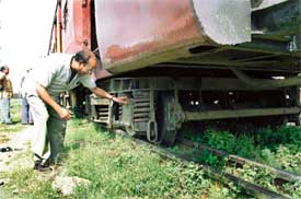 A Railways official having a look at the derailed coach of the Ferozepore passenger train at Ludhiana railway station. Two coaches of the train derailed during shunting at the railway station 