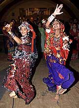 Women perform Garba, a traditional dance, during the fourth day of the nine-day Navratri festival