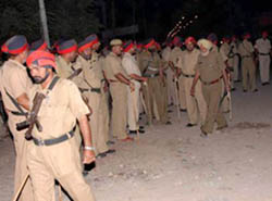 Punjab police personnel take over the reins of the Bhargav Camp locality following an alleged incident of firing and subsequent outbreak of violence by an agitating mob in Jalandhar on Monday. 