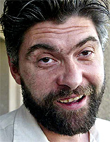 Australian reporter John Martinkus speaks to journalists on his arrival at Amman airport on Monday