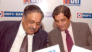 M. Damodaran, Chairman and MD of UTI AMC and Aditya Puri, MD, HDFC Bank, exchange notes at the announcement of UTI Mutual Fund tie-up with HDFC Bank for distribution of UTI Mutual Fund Schemes in Mumbai on Tuesday.