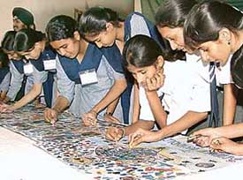 Schoolchildren take part in a painting competition at Gian Jyoti Public School, Mohali, on Tuesday. 
