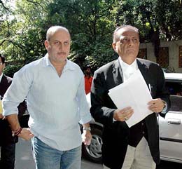 Former chairman of the Central Board of Film Certification Anupam Kher along with a lawyer arriving at a court