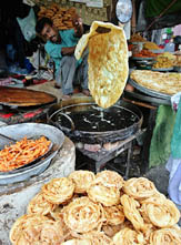 A Kashmiri prepares traditional breads during the holy month of Ramzan