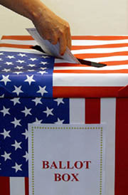 A voter casts his ballot as absentee voting gets under way in the US presidential election in Cape Town on Tuesday.