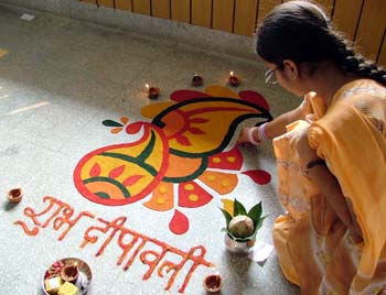 A student makes a rangoli in Ramgarhia Girls College, Ludhiana, on Wednesday