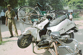 Vehicles, damaged by a CTU bus, being taken by the police in a rickshaw in Chandigarh on Thursday.
