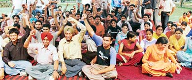 Students stage dharna in front of the Thapar hall, PAU, Ludhiana, on Thursday