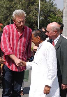 Former Wimbledon champion Boris Baker of Germany shakes hand with Uttar Pradesh Chief Minister Mulayam Singh Yadav