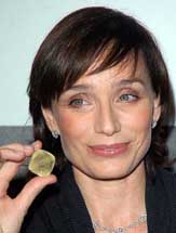 British actress Kristin Scott Thomas holds what is said to be the worlds oldest diamond during the presentation to the press of an international jewellery exhibition, in Venice, Italy, on Thursday.