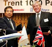 Rolls-Royce Group PLC Managing Director-Airlines Charles Cuddington (R) shakes hands with Kawasaki Heavy Industries Ltd Senior Vice-President and Gas Turbine & Machinery Company President Takashi Yoshino during a signing ceremony that Kawasaki will be a risk and revenue sharing partner (PRSP) on the Trent 1000 engine being developed for the Boeing 7E7 Dreamliner airplanes at a Tokyo hotel 