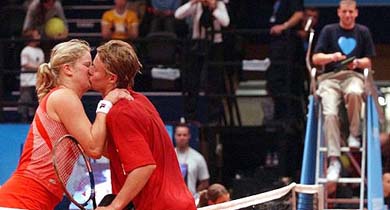 Belgiums Kim Clijsters kisses Australian Lleyton Hewitt after their love match tennis game at the Expodroom in Bree, Belgium,