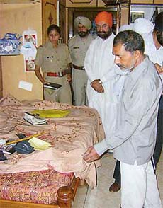 Police officials investigate the murder of Mahant Pritam Singh at Gurdwara Bhai Ram Krishan in Patiala