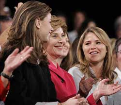 First Lady Laura Bush, with her daughters, Barbara and Jenna, at a campaign rally for President George W. Bush at Canton Palace Theatre on Friday. 