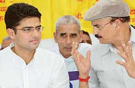 Mr Sachin Pilot (left) and Mr Rustam Singh, Cabinet Minister in Madhya Pradesh Government discuss a point at the function of the Gujjar Samaj Kalyan Parishad at Gujjar Bhavan in Sector 28, Chandigarh