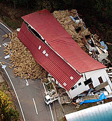 An aerial view shows a collapsed warehouse, after a powerful earthquake hit on Saturday, in Yamakoshi village, northwestern Japan on Sunday. Strong aftershocks shook northern Japan after the country's deadliest earthquake in nine years killed at least 19 persons.