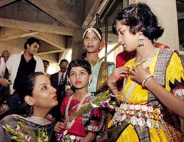 Bollywood actress and social worker Shabana Azmi is greeted by children during the 40th anniversary celebration of SOS Children Villages 