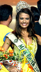 Priscilla Meirelles of Brazil, crowned Miss Earth 2004, waves to the crowd during the coronation night in Manila on Sunday
