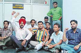 NSUI activists raise slogans against the Controller of Examination, Panjab University, Chandigarh, on Tuesday. 