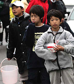 Residents queue for water in Nagaoka, northern Japan, on Tuesday