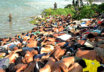 Thai soldiers detain hundreds of demonstrators after they clashed with the police in Narathiwat province on Monday