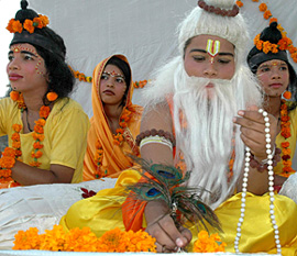 Devotees depict a scene of the Valmiki ashram during a shobha yatra on the eve of Valmiki Jayanti in Chandigarh on Wednesday.