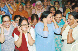 Members of the Clapping and Laughing Club of the Senior Citizens Forum, Sector 47, Chandigarh, celebrate the annual day on Tuesday.