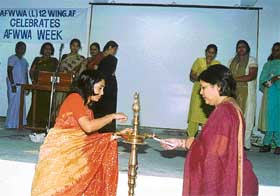 Ms Latika Tilloo, president, AFWWA (L) 12 Wing AF, inaugurates week-long celebrations on Tuesday.