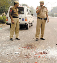 Police officials inspecting the spot of accident at Bhairo Mandir Marg in the Capital on Wednesday. 