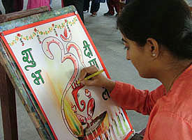 One of the participants at a poster-making competition held at SDP College for Women in Ludhiana on Wednesday.