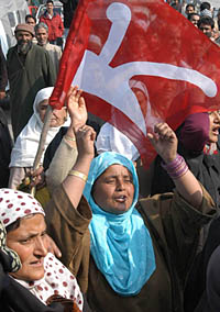 Women supporters of the National Conference raise anti-government slogans during a demonstration in Srinagar on Thursday.