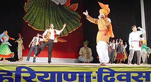 Artistes perform during the Haryana Day state-level festival in Kurukshetra 