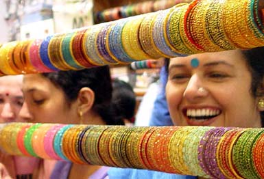 Women choose bangles for Karva Chauth in Ambala on Saturday