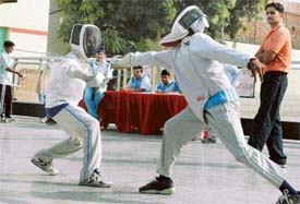 A match in progress during the Ludhiana District Fencing Championship which begins at Sacred Heart School