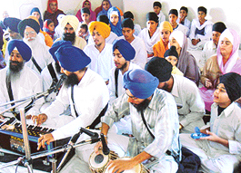 Schoolchildren participate in the Baal Utsahit Gurmat Samagam at Harcharan Kamal Sahib Gurdwara, Phase 10 in Mohali on Sunday.