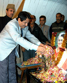 Union Minister Ghulam Nabi Azad looks on as Jammu and Kashmir PCC chief Peerzada Mohd Sayeed lays flower wreaths on the portrait of Indira Gandhi