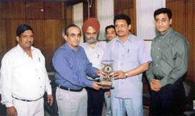Officials of Life Insurance Corporation of India honour Vijay Gupta