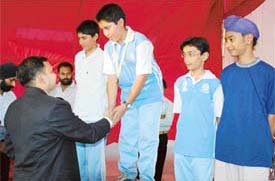 Mr Parag Jain, DIG, Ludhiana Police Range, gives away medal to a winner in fencing championship held in Ludhiana on Sunday