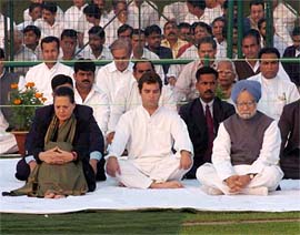 Ms Sonia Gandhi, Congress President, with her son, Rahul Gandhi, and Prime Minister Manmohan Singh during a prayer ceremony at the Indira Gandhi memorial on the 20th anniversary of Indira Gandhis assassination, in New Delhi on Sunday. 