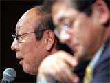 Toyota Motors Senior Managing Director Takeshi Suzuki and Managing Officer Takashi Hata speak during a news conference
