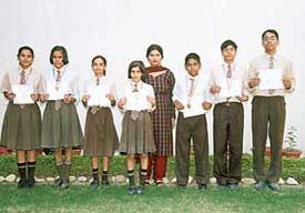 Students of Manav Mangal School, Panchkula, who won National Cyber Olympiad, display their medals and certificates.
