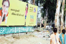Garbage piles up around a garbage bin along the Ferozepur road