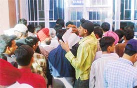 Assessees in queues at the counters of Income Tax Office in Ludhiana on Monday