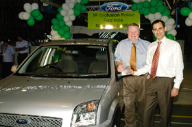 Jim Padilla, Ford Motor Company Chief Operating Officer, flags off the first production unit of the new Ford Fusion at the Ford India plant in Maraimalai Nagar, Chennai, on Tuesday.