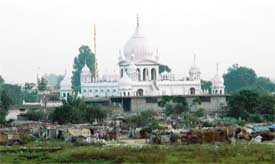 Huts have come up again around this gurdwara in Sector 38-West, Chandigarh