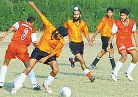 A match in progress during the first Lt Col I.S. Deol Memorial Football League 2004