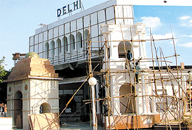 Workers give finishing touches to Delhi pavilion at Pragati Maidan, where the annual International Trade Fair is scheduled to begin on November 14