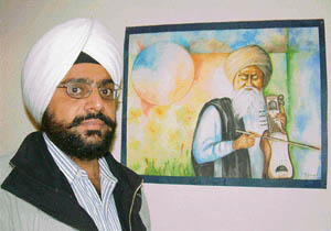 Tejwant Singh with one of his paintings