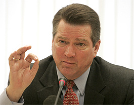 Russian oil major Yukos CEO Steven Theede speaks at a news conference in Moscow on Wednesday